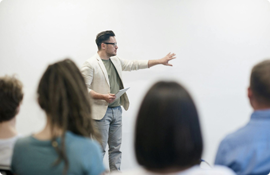 man presenting to a group of people